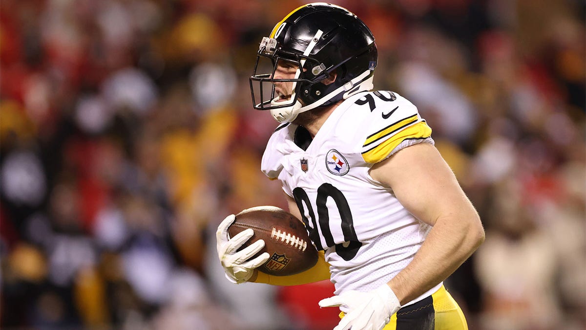 T.J. Watt runs with ball