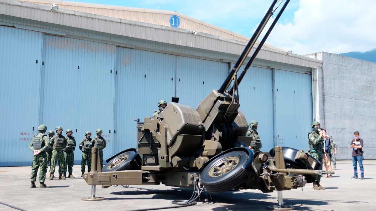 Taiwanese soldiers operate a Oerlikon 35mm twin cannon anti-aircraft gun at a base in Taiwan's southeastern Hualien county