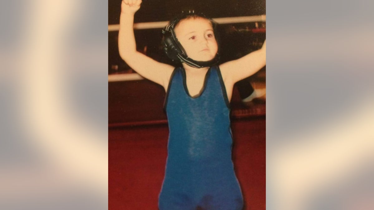 Young Rylee in a wrestling outfit