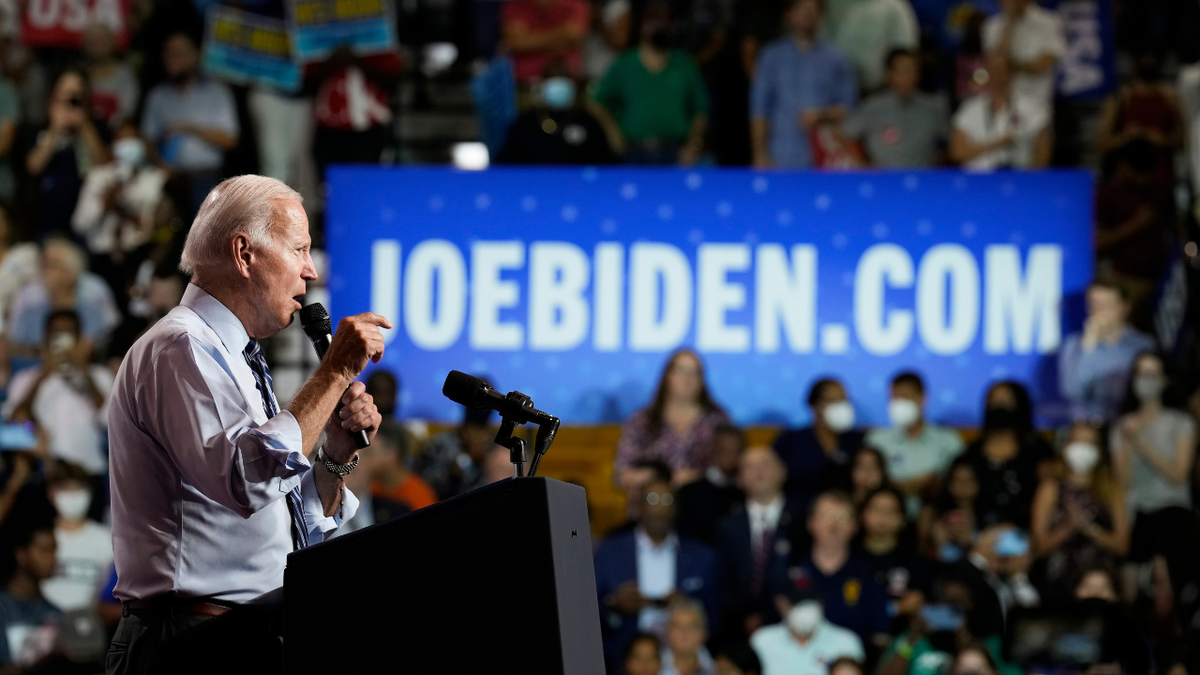 President Biden rally with joebiden.com sign