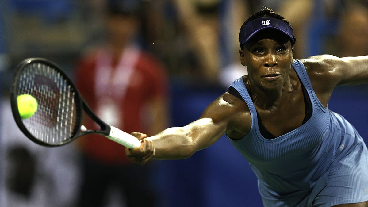 Venus Williams returns a shot