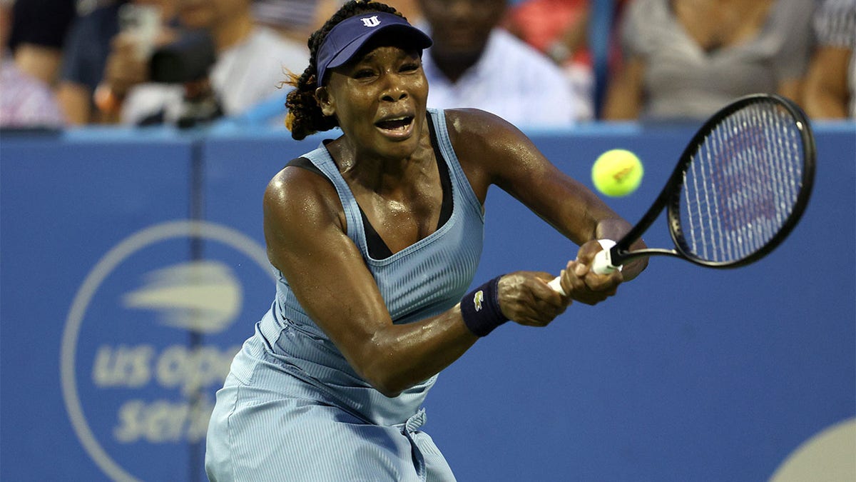 Venus Williams returns a shot