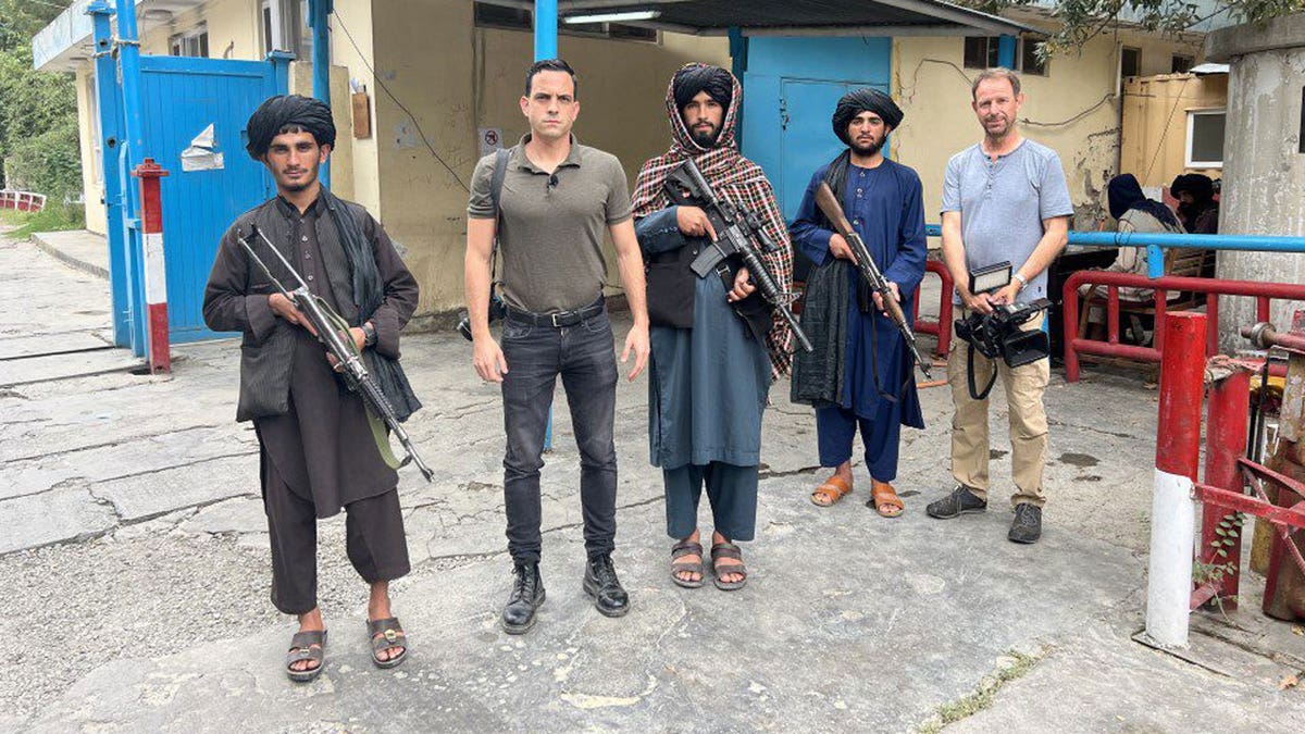 Afghans carrying guns