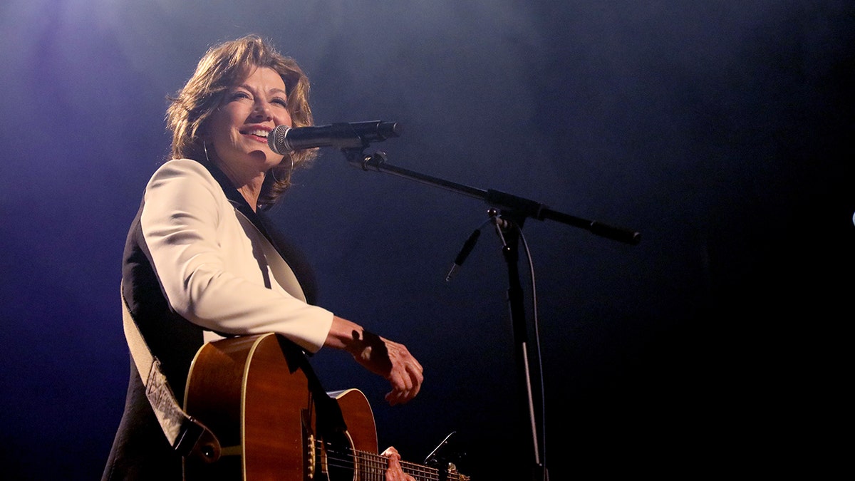 Amy Grant playing guitar
