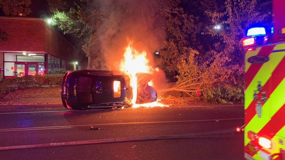 flames engulfing car