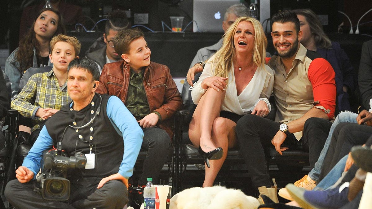 Britney Spears at a basketball game with her sons and Sam Asghari