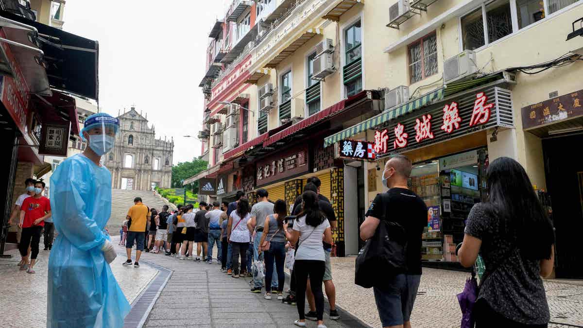 People wait in line for COVID tests in China