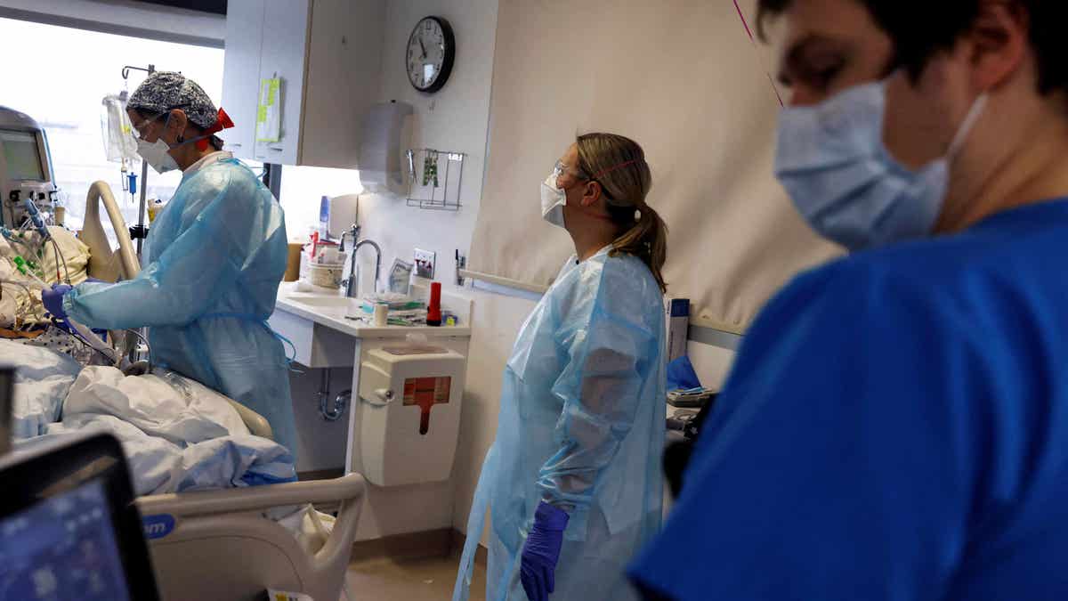 Doctors treat COVID-19 patient