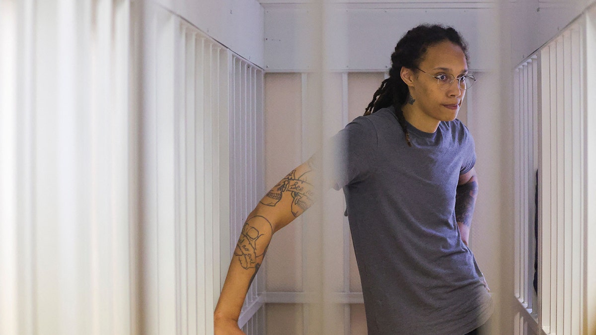 Brittney Griner sits in court room cell