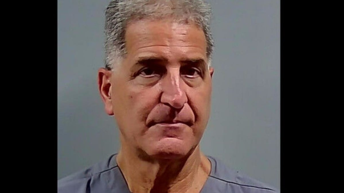 Florida dentist Charles Stamitoles appears in a mug shot