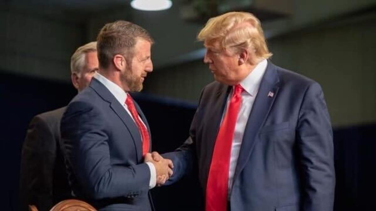 Markwayne Mullin shaking hands with Donald Trump