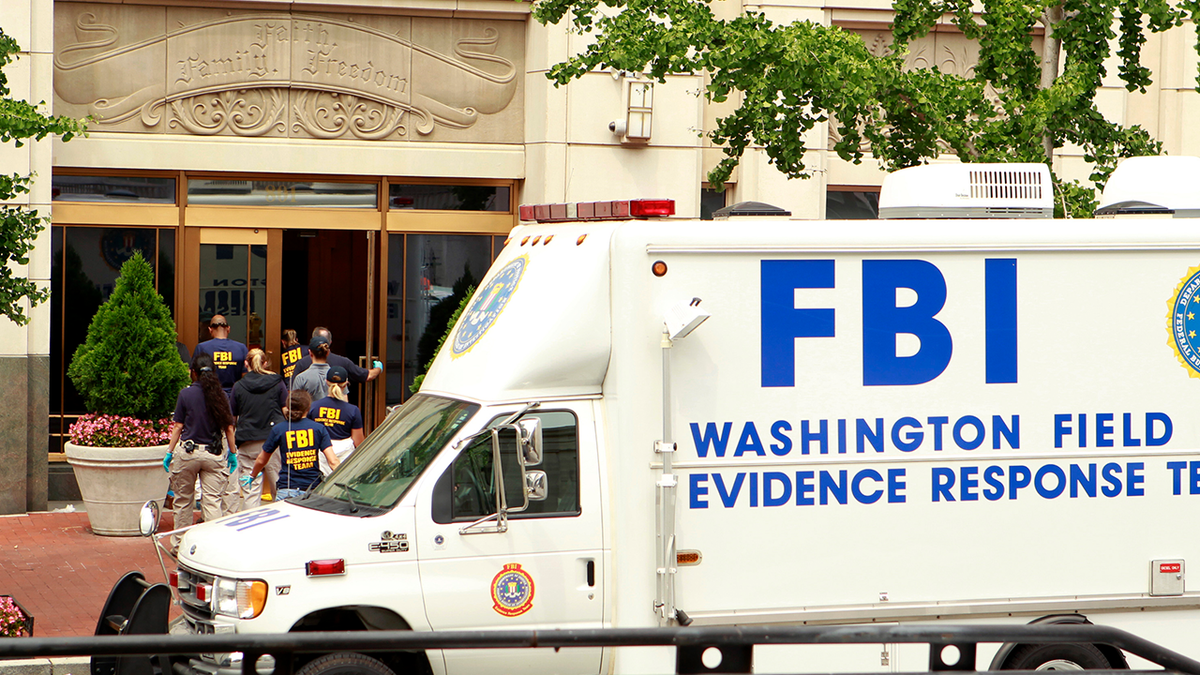 An FBI van is seen outside of the Family Research Council during an investigation following an attack on the Christian nonprofit