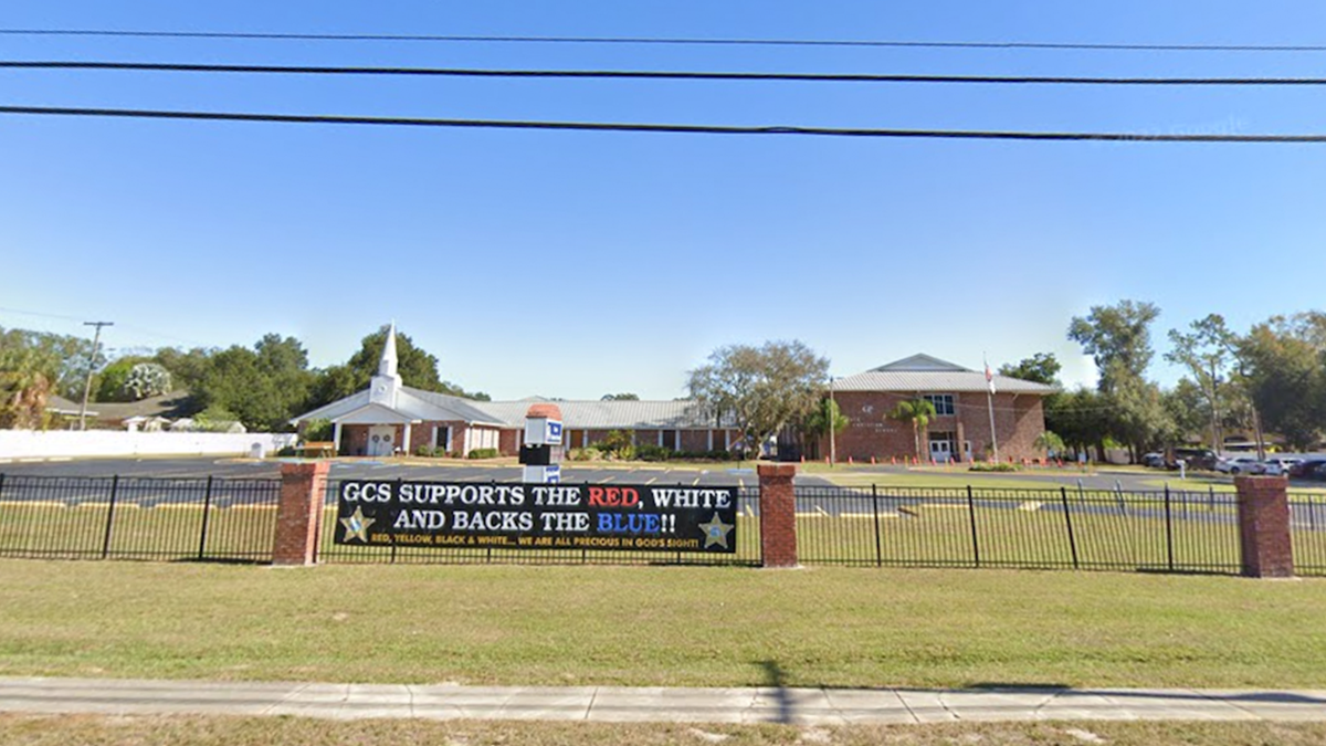 Photo shows entrance to Grace Christian School in Florida, including sign pledging support to the police