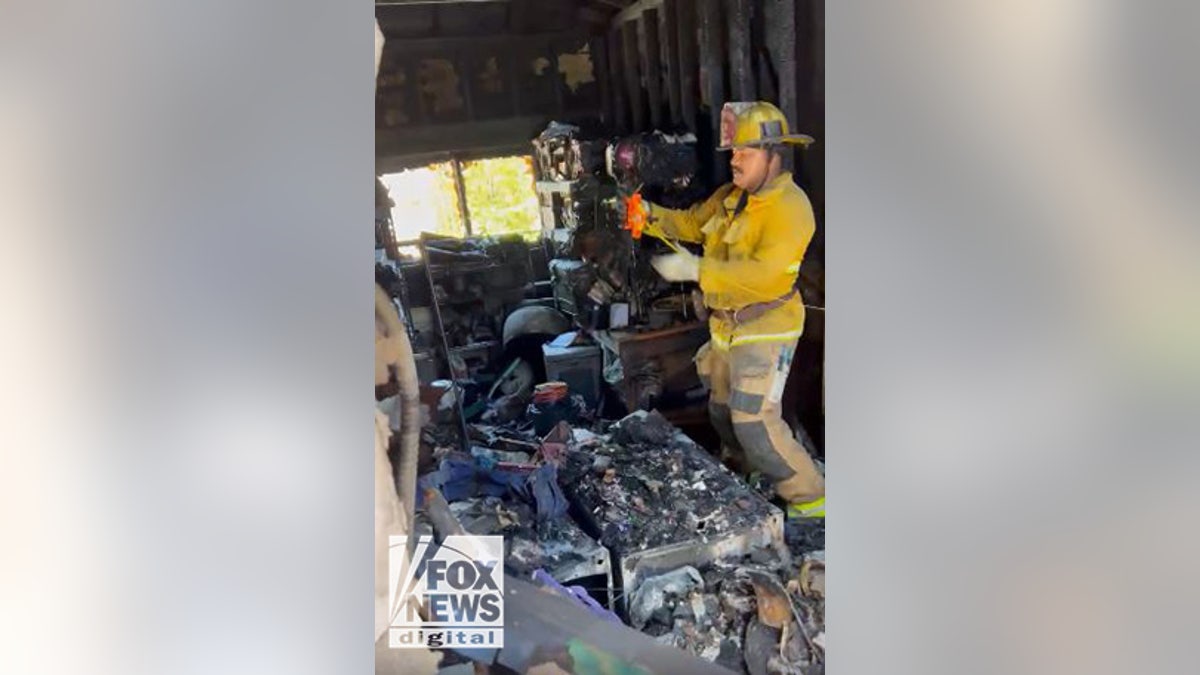 LAFD takes measurements of Lynne Mishele's burned out home