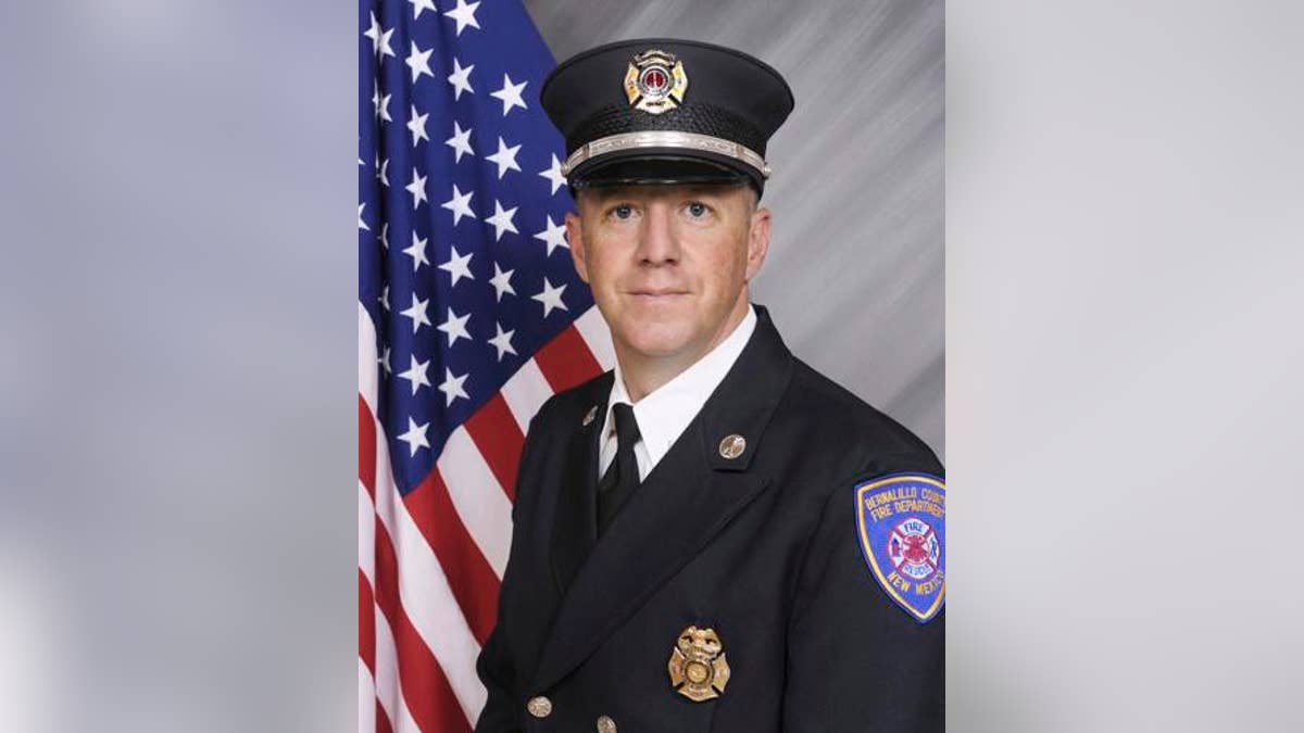 Lt. Matthew King poses for a photo wearing his firefighter uniform