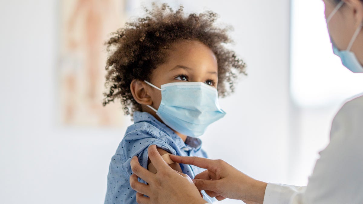 boy receives vaccine