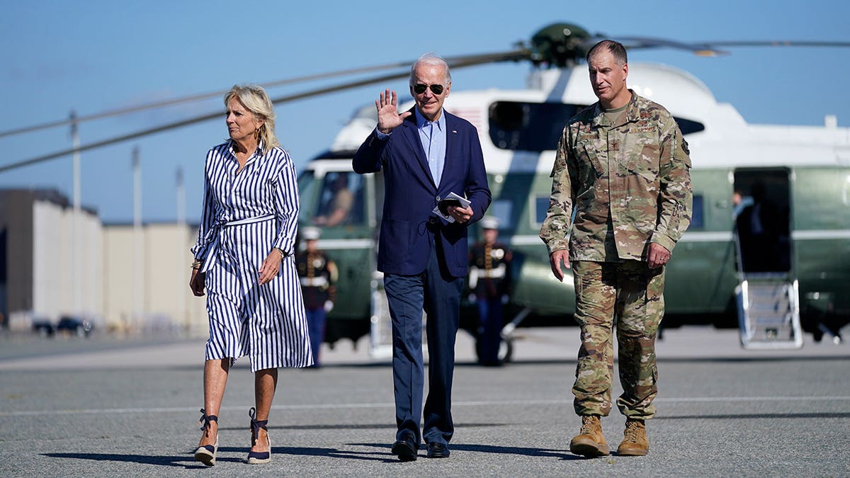 President Joe Biden and First Lady Jill Biden walk 