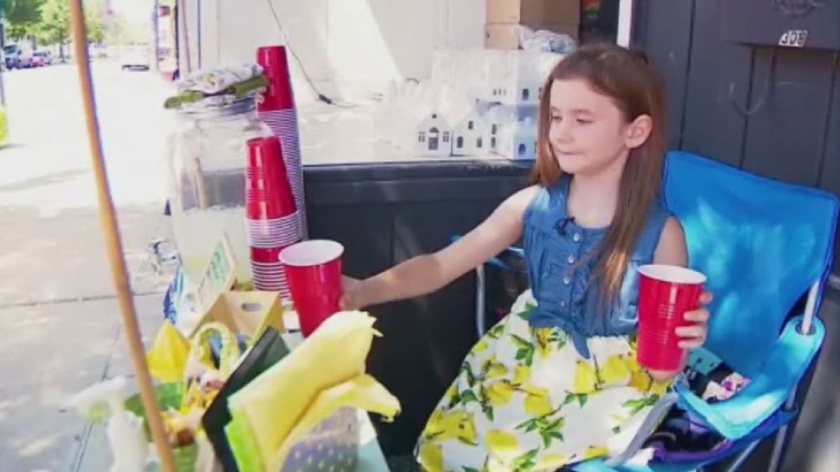 8-year-old Asa Baker selling lemonade in Alliance, Ohio