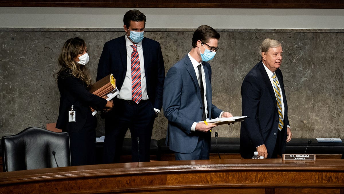 Sen. Lindsey Graham with aides