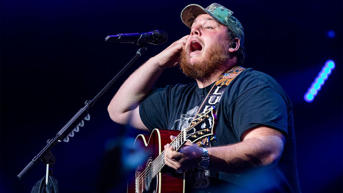 Luke Combs performing on tour