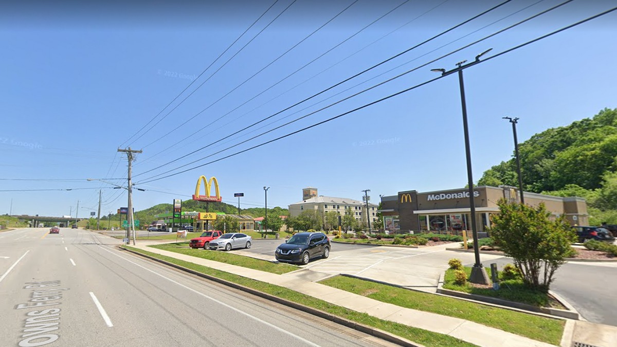 Photo shows parking lot for McDonald's in Chattanooga, Tennessee with cars on the parking lot