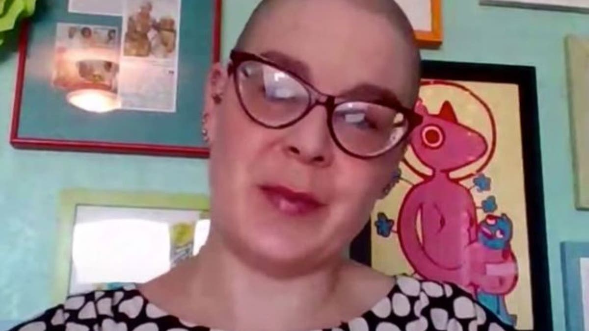 Screenshot of Miranda Galbreath in glasses with a polka-dot top from YouTube video