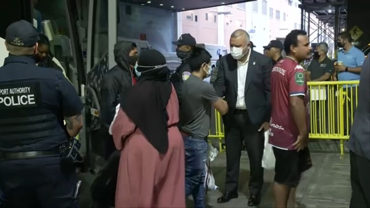 NYC migrants get off bus