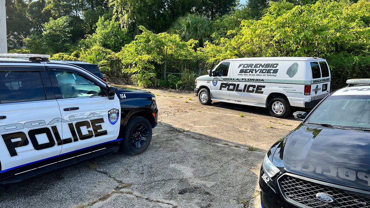 Ocala police vehicles at a wooded area