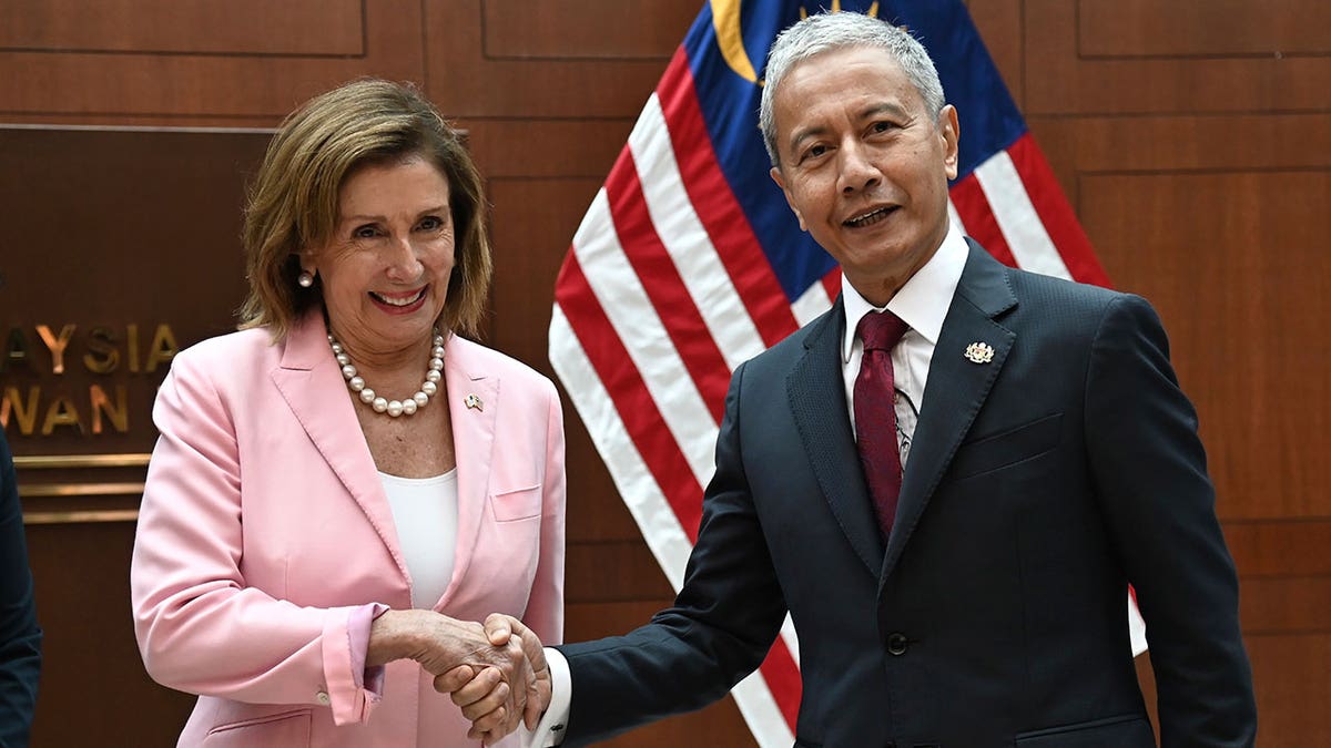 Pelosi shakes hands with Malaysia Parliament speaker