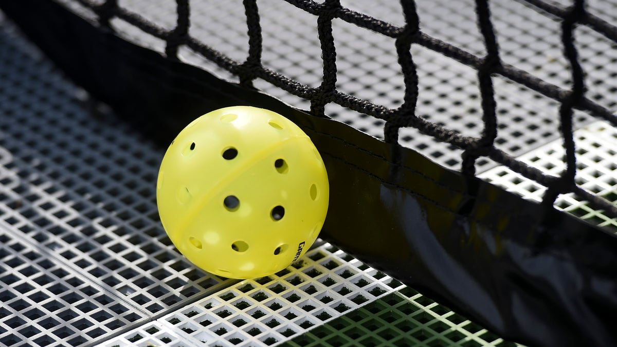 A plastic pickleball