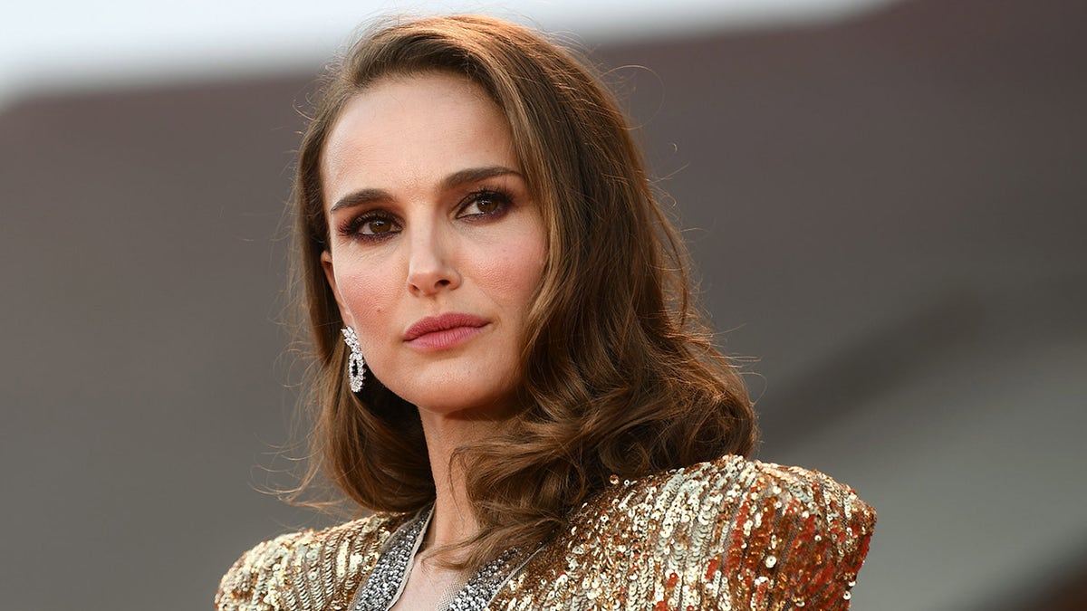 Natalie Portman wears gold dress