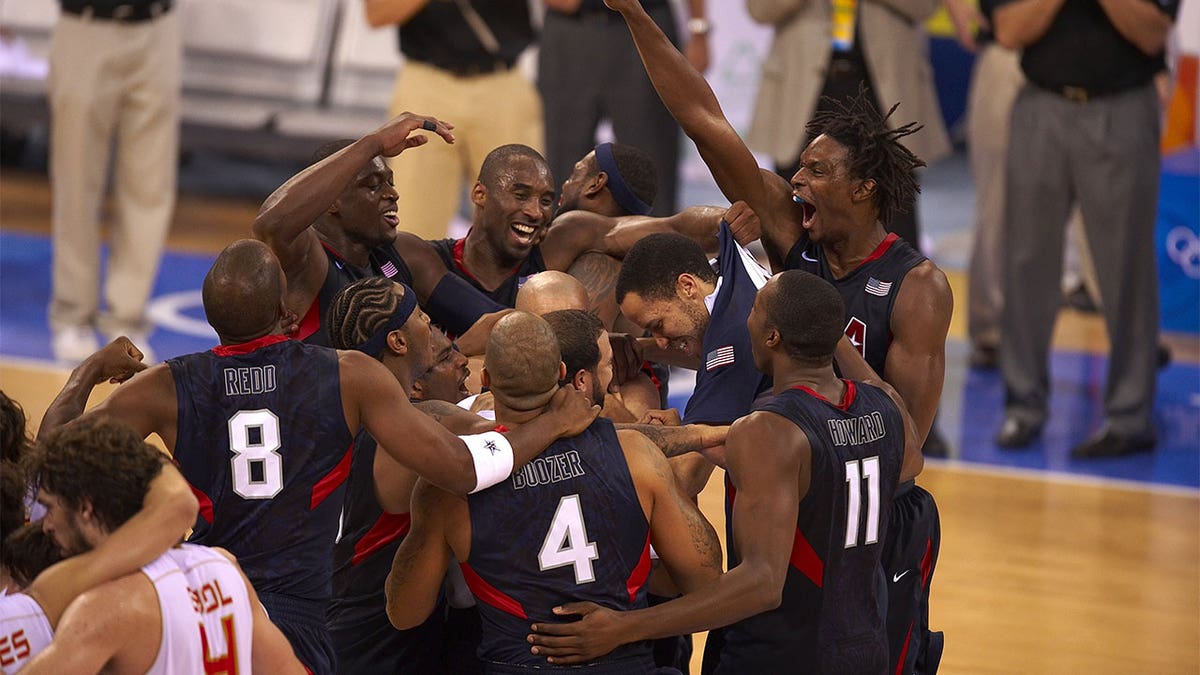 2008 Men's Olympic basketball team celebrating on court