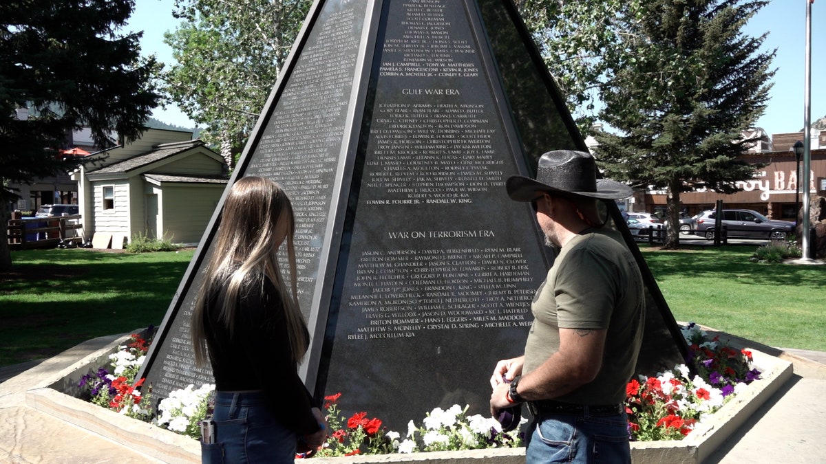 Rylee's family in front of war memorial
