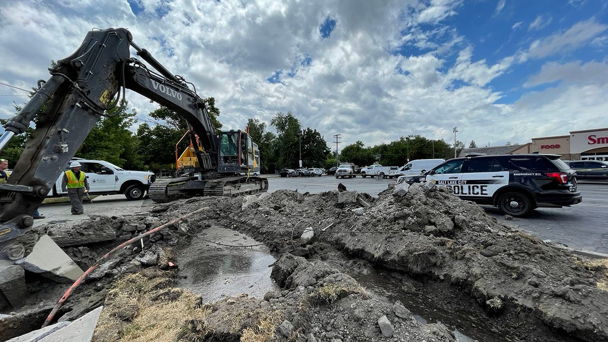 Excavator dung up parking lot