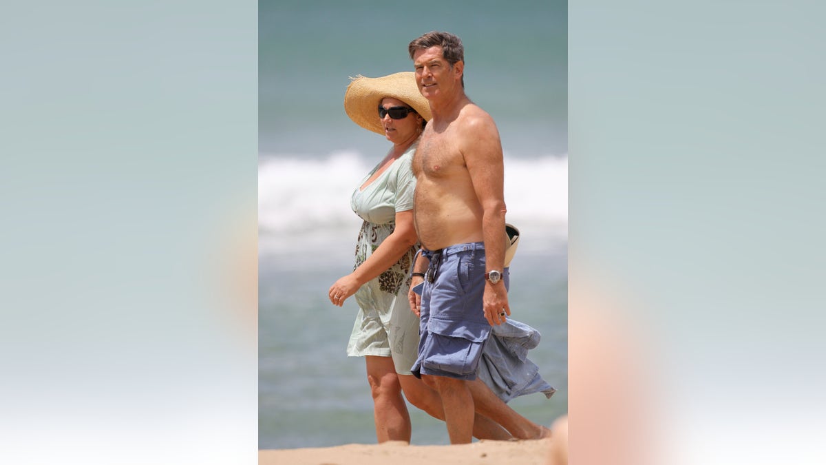 Pierce Brosnan and Keely Shaye Brosnan walking