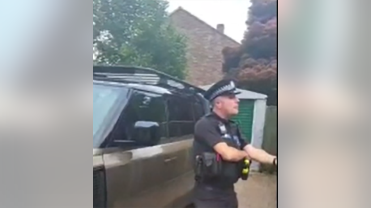 hampshire police officer arresting man