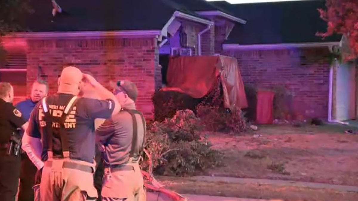 Investigators looking at pickup truck that crashed into home