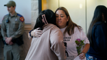 Uvalde residents hugging each other