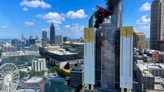 Atlanta skyscraper fire sends a dark column of smoke into the sky