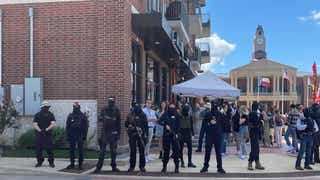 Masked Antifa protesters show up brandishing weapons at 'drag brunch' with kids