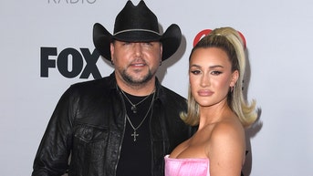 Jason Aldean's wife blames 'wokeness' for Billboard 100 greatest country artists of all time list snub - Fox News