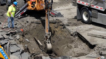 Vehicle swallowed by sinkhole in Boston, broken water main to blame
