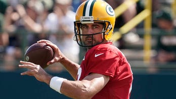 Aaron Rodgers reacts to roughing the passer call on Chiefs' Chris Jones