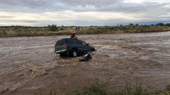 Dramatic video, photos show New Mexico driver being rescued from floodwaters
