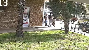 Florida woman robbed at gunpoint while holding baby, two arrested: police