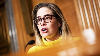 Progressive groups take aim at Sinema over decision to remove carried interest tax loophole from Manchin bill