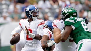 Giants' Tyrod Taylor suffers back injury after taking huge hit