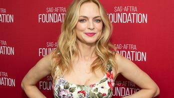 Heather Graham poses in animal print bikini as she takes in 'the color of the water' during Italian getaway