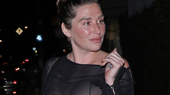Kesha steps out in see-through black dress during dinner date with mom