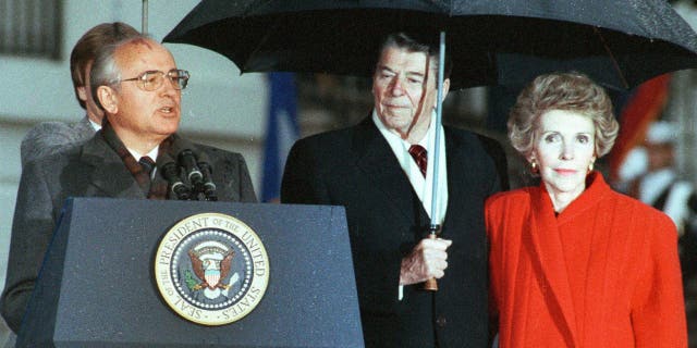 President Reagan and his wife Nancy listen to Mikhail Gorbachev speak during the Soviet leader's departure ceremony at the White House, Dec. 10, 1987.